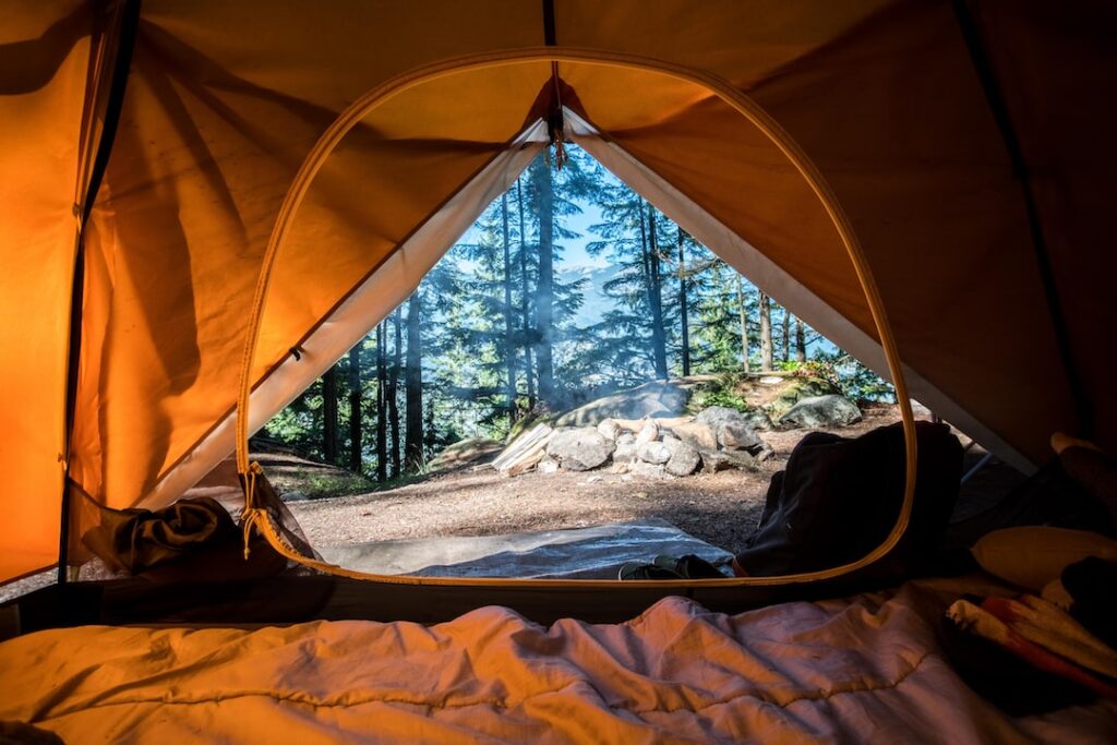 Open tent, showcasing the breathtaking wilderness for outdoor adventure